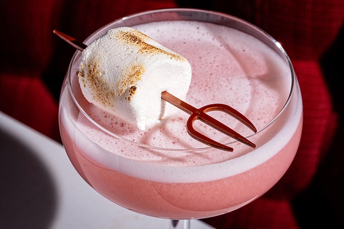 Close up of a cocktail with a toasted marshmallow